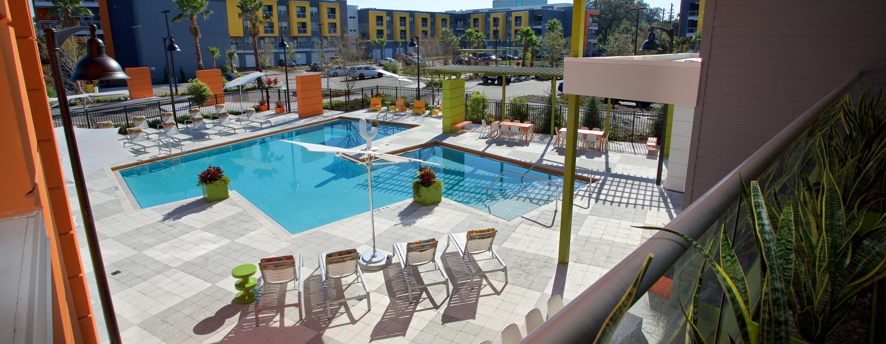 a pool with chairs around it