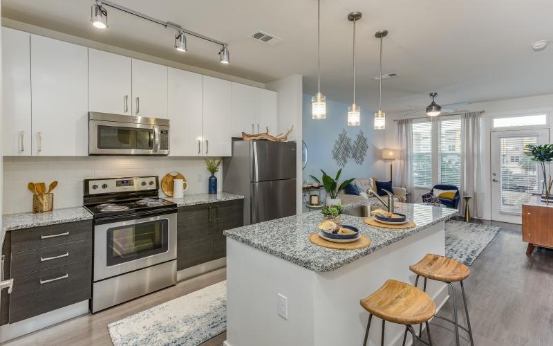 a kitchen with white cabinets