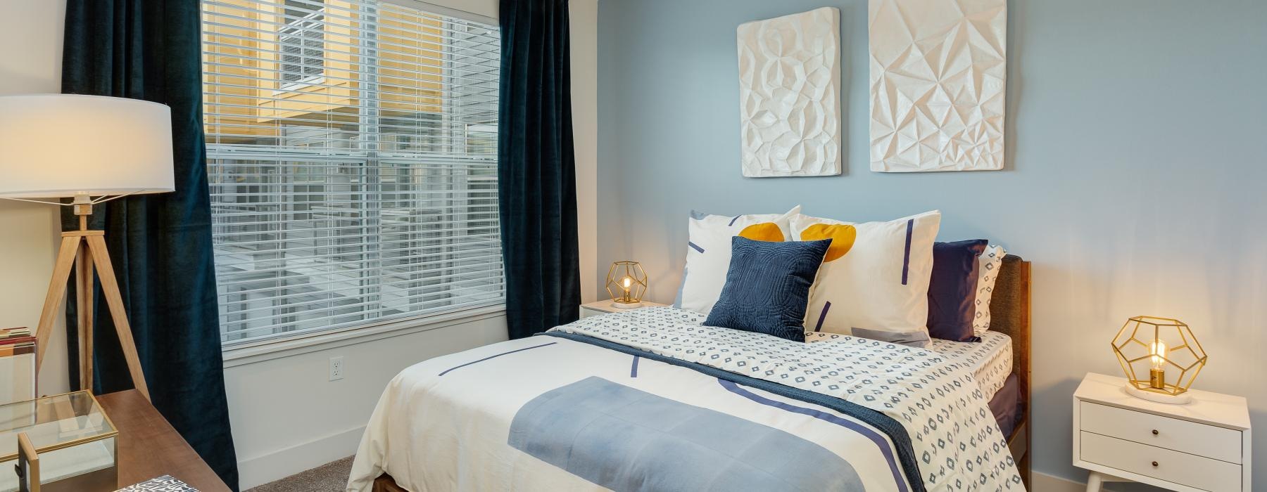 a bedroom with a bed and a fan